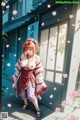 A woman in traditional attire stands outside a building with cherry blossoms.