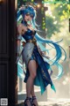 A woman with long blue hair standing in front of a door.